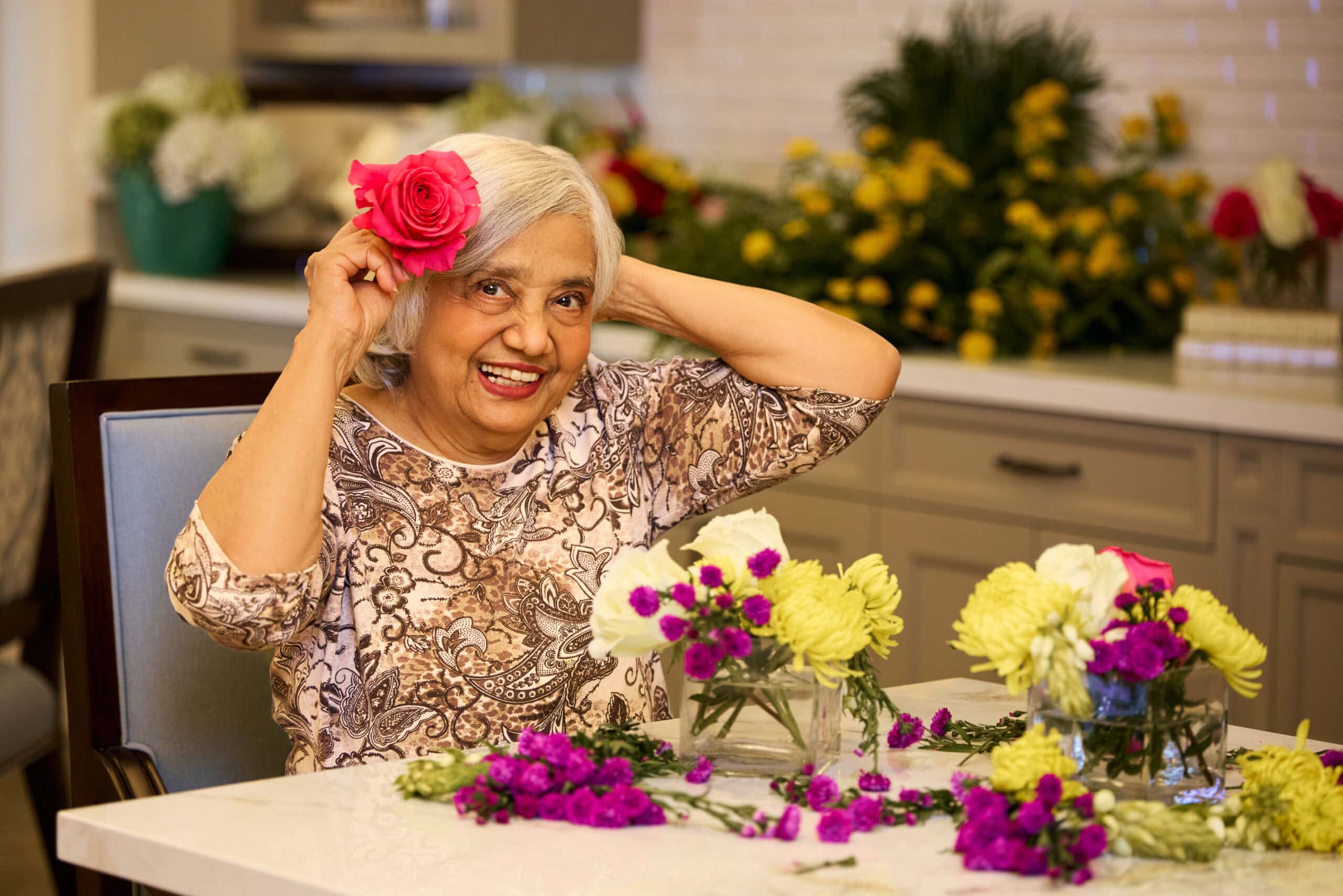Senior lady doing flower arrangments