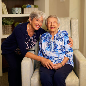 Senior lady and her adult daughter embracing