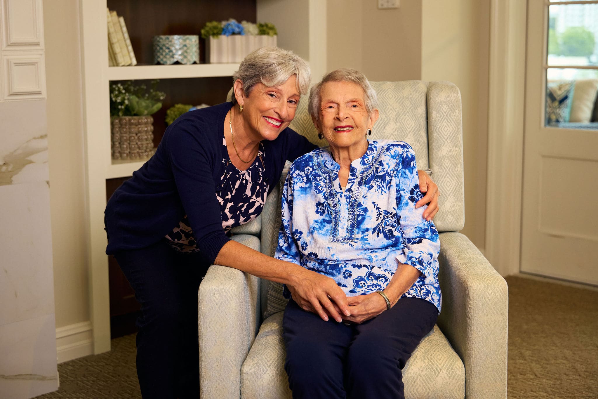 Senior lady and her adult daughter embracing
