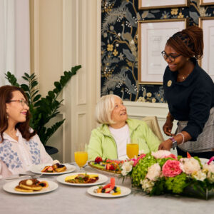 seniors being served brunch