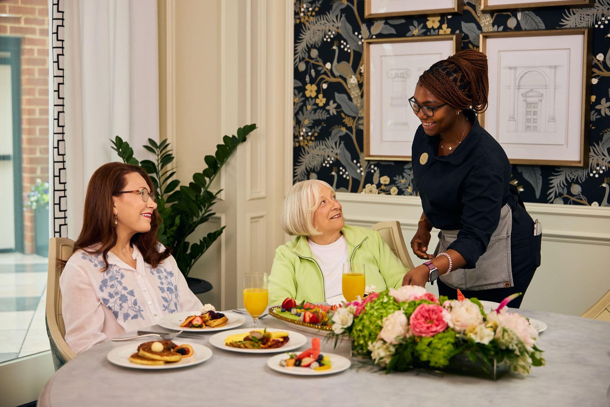 seniors being served brunch