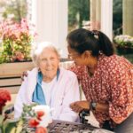 two women smiling together