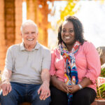 old man sitting with woman