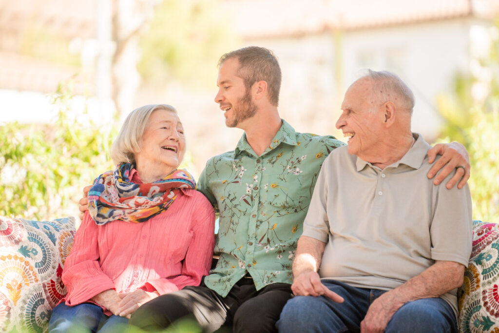 man and older couple sitting together