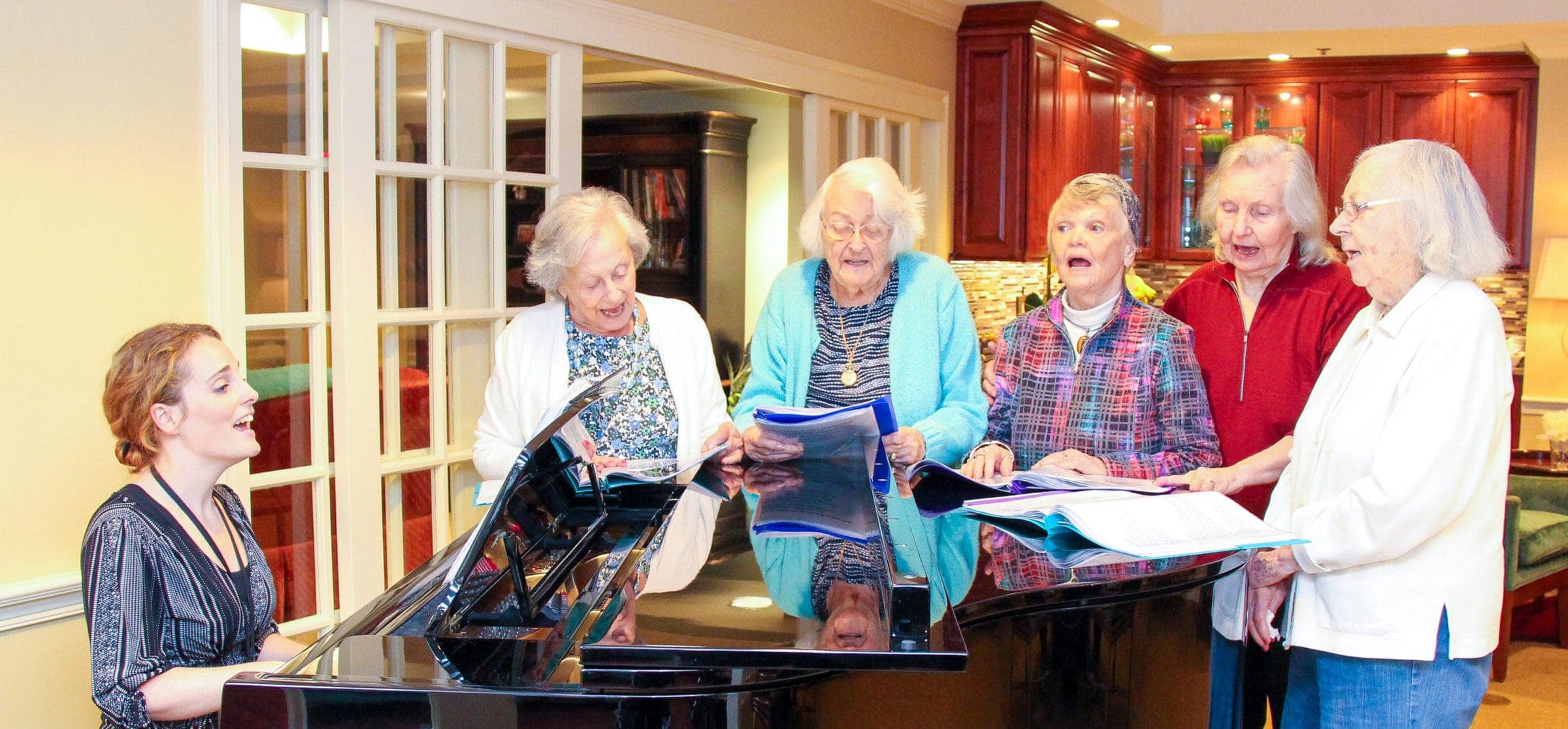 Music Therapist Jessie Powers Leads Piano Singers at Kensington Park Senior Living