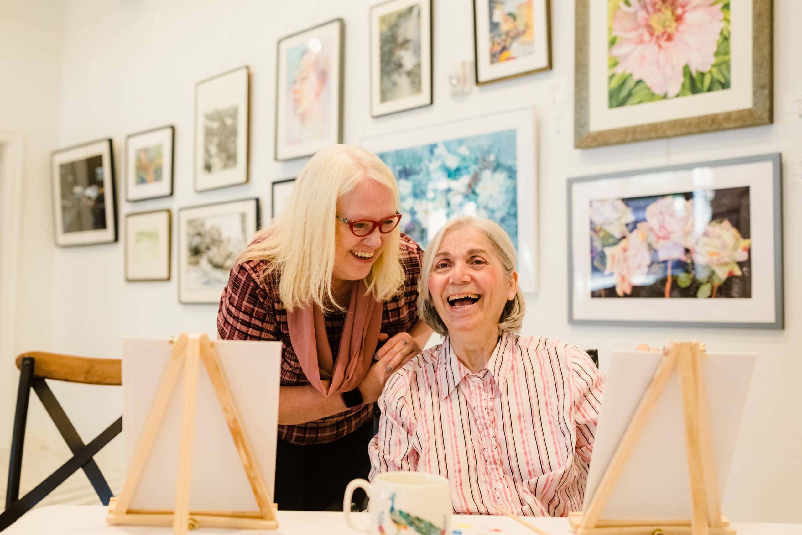 Tonya Embly with resident in art studio