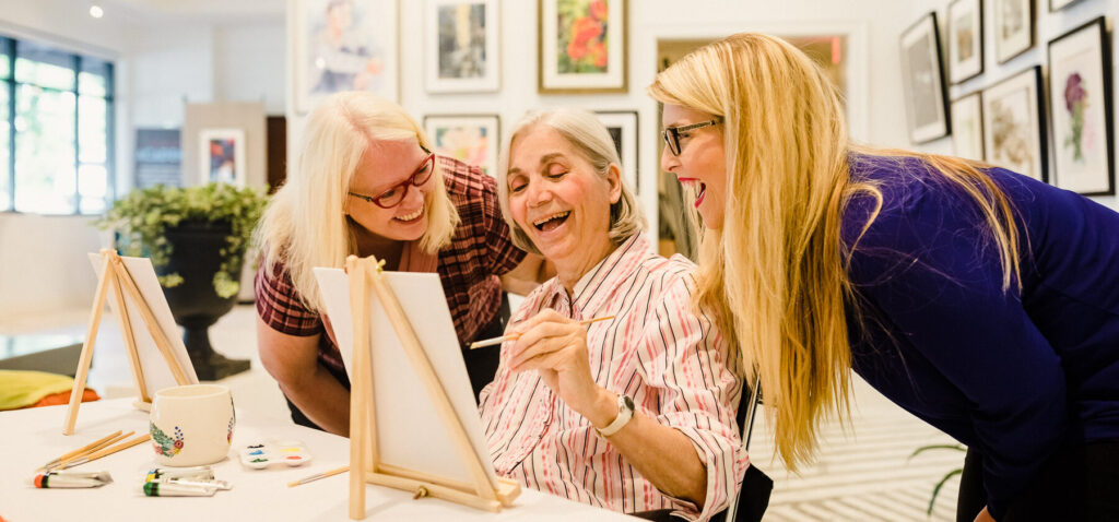three ladies painting together