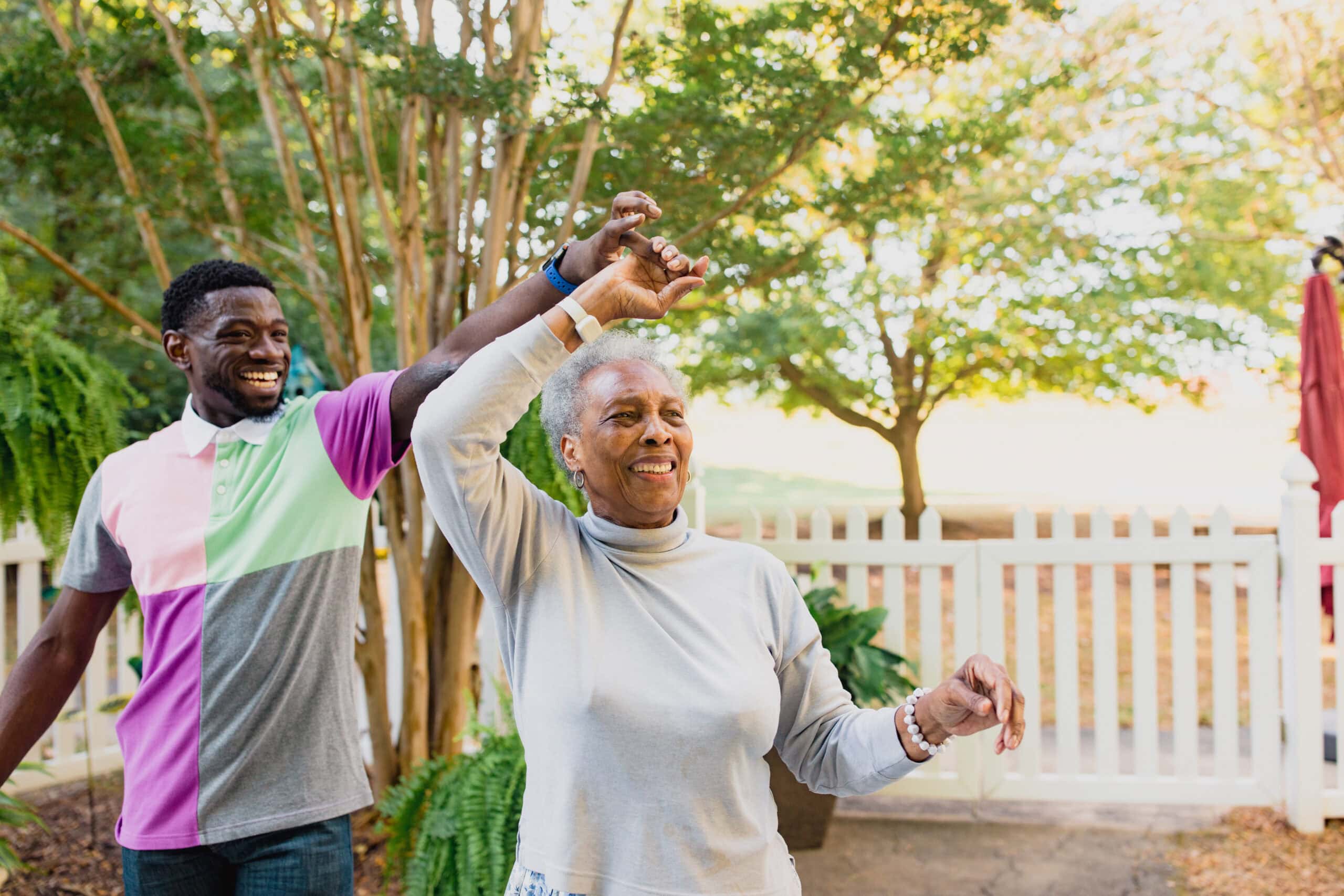 young man and older woman dancing