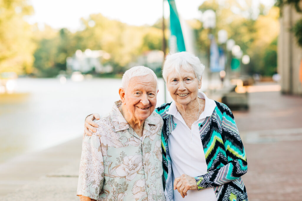 Older couple going for a walk by the lake