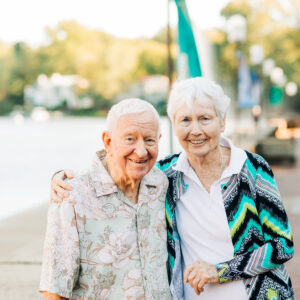 Older couple going for a walk by the lake