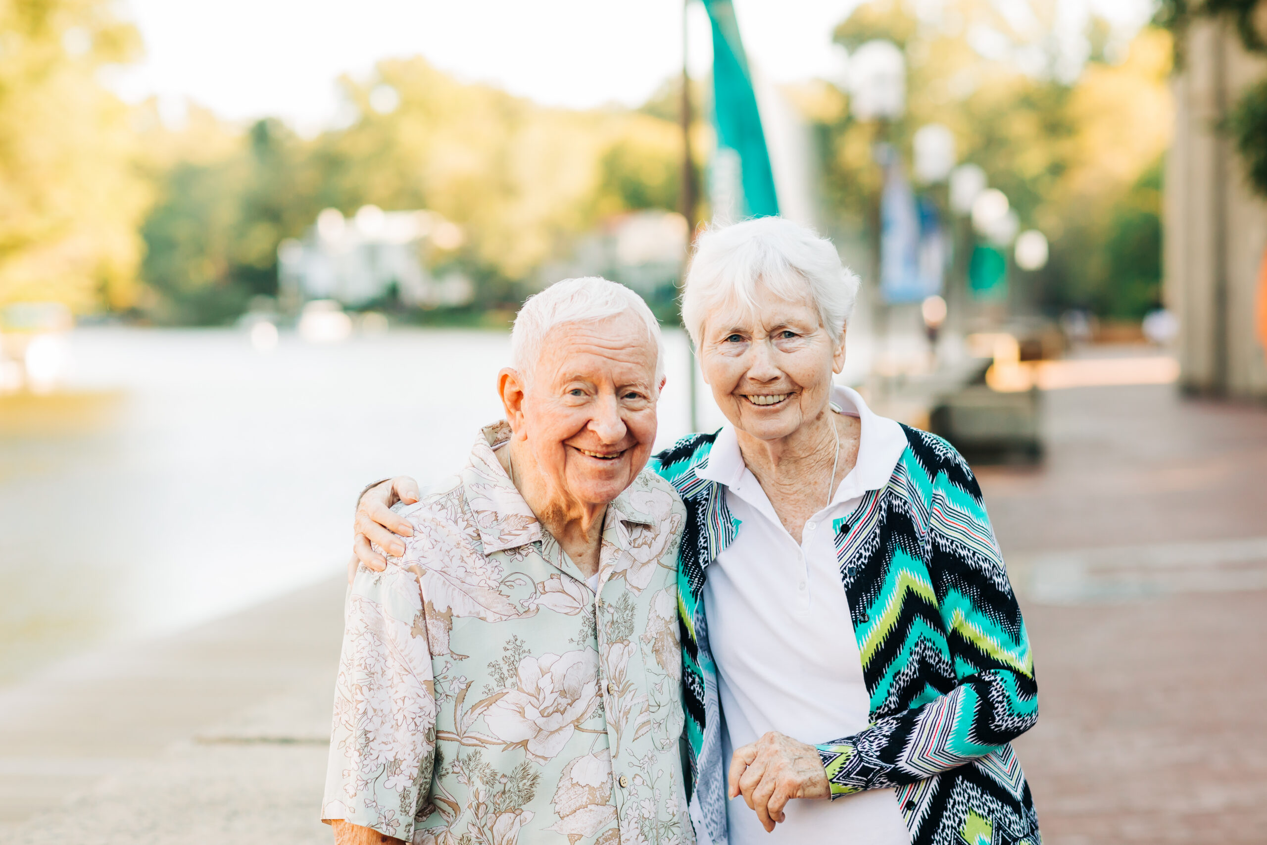 Older couple going for a walk by the lake